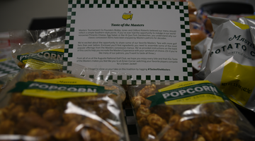 Image of the 'Taste of the Masters' info card next to some popcorn. 